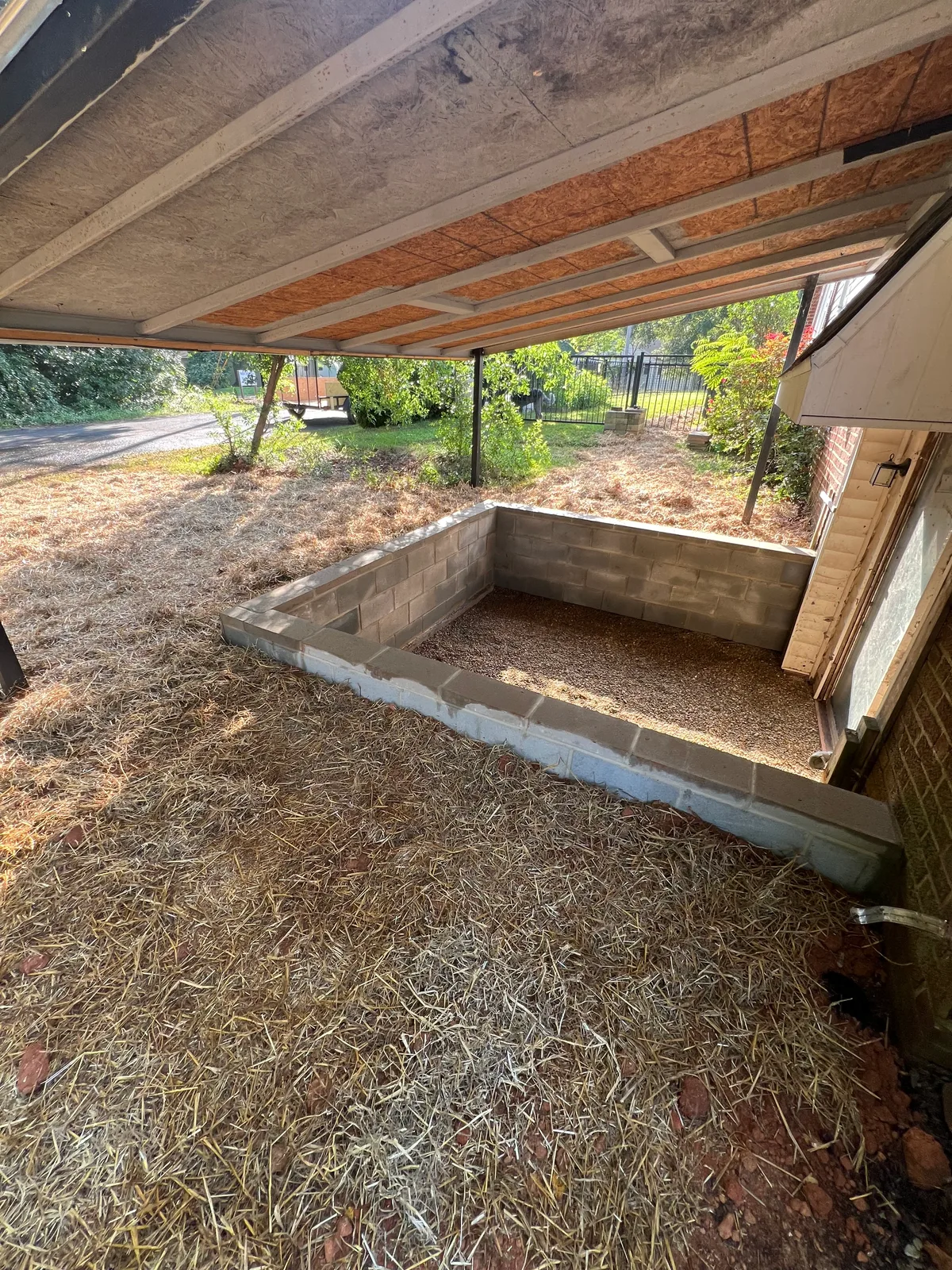 Finished pea-gravel backyard hangout area outside the rear entrance